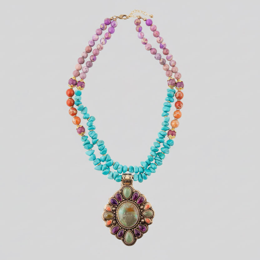 Multicolored beaded necklace with a large decorative pendant on a white background