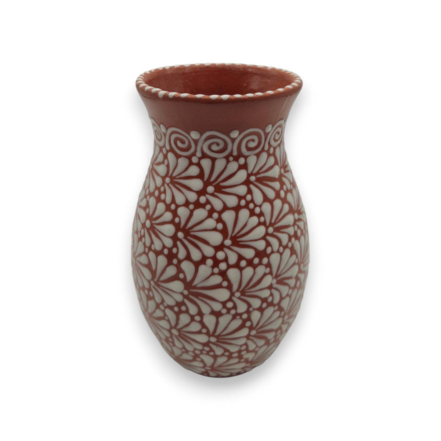 Ceramic vase with white floral pattern on a white background