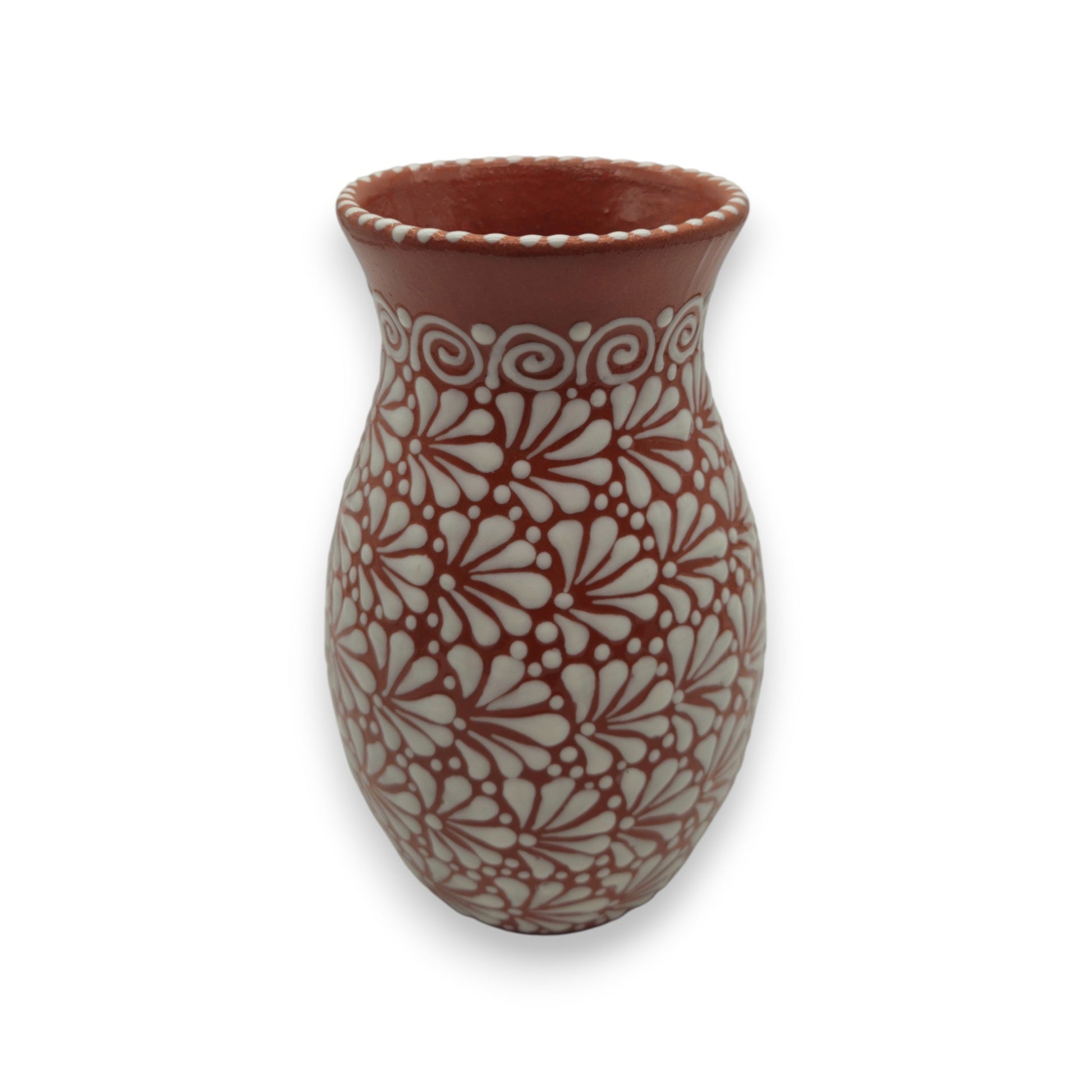 Ceramic vase with white floral pattern on a white background