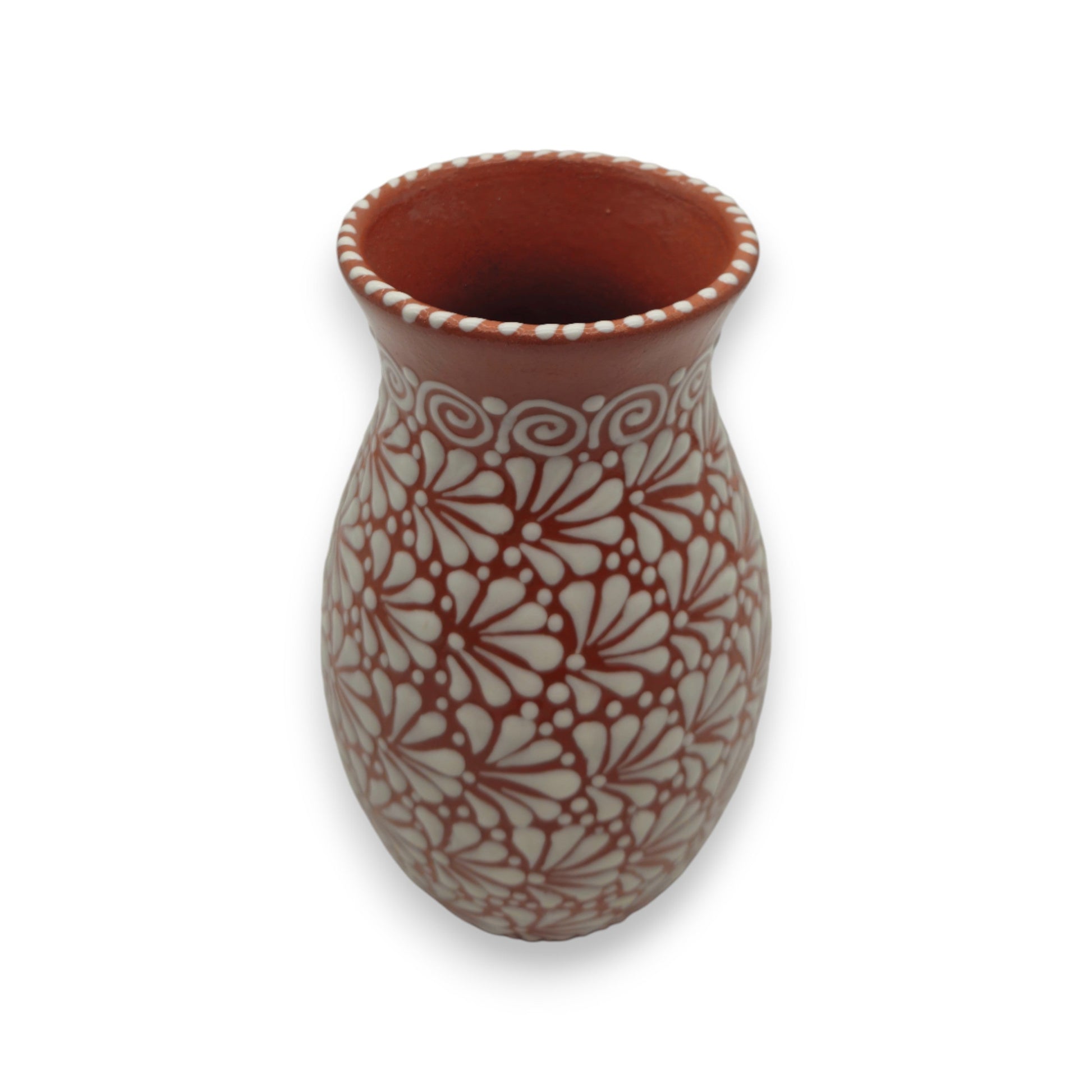 Ceramic vase with white floral pattern on a white background
