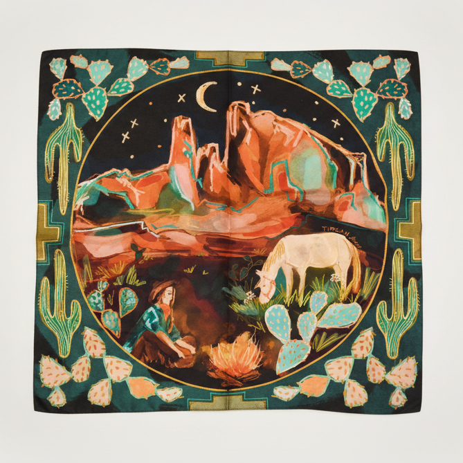 Decorative scarf with desert landscape design featuring a woman, horse, and cacti.