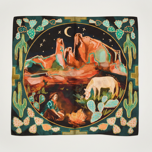 Decorative scarf with desert landscape design featuring a woman, horse, and cacti.