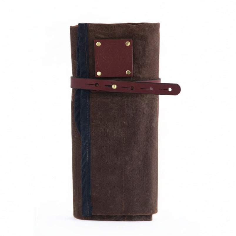 Brown leather wallet with a strap on a white background